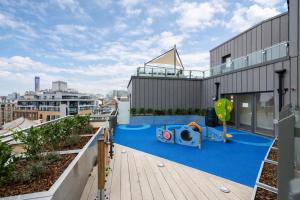 an apartment with a playground on the roof of a building at Roomspace Serviced Apartments - Vertex House in Croydon