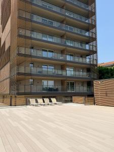 a group of chairs in front of a building at ArtStay - Luxury Apt 1 Gym and Pool in Milan