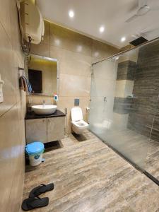 a bathroom with a sink and a toilet and a shower at The leaf and Hill in Alwar