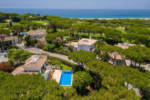 an aerial view of a house and the ocean at Villa Mia - Vale do Lobo in Vale do Lobo