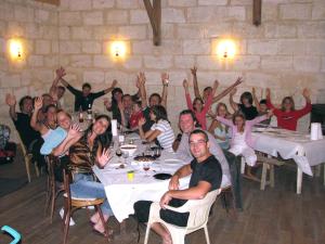 a group of people sitting at tables in a restaurant at Le Vélo Vert in Sadirac +23 photos