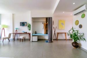 a living room with a desk and a table at Naiya Sea Resort in Sihanoukville