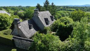 an aerial view of a house in the trees at La Fournio in Chaussenac