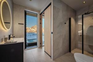 a bathroom with a view of the ocean at Secluded Lodge - Stunning Views! in Storøya +46 photos