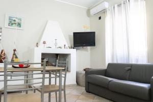 a living room with a couch and a table at Casa di Nonna Nì - Due alloggi con scala interna condivisa in Portocannone