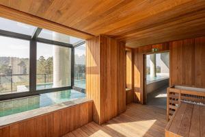 a room with a swimming pool and a large window at Sky Designer Alphaville - 1611 in Barueri