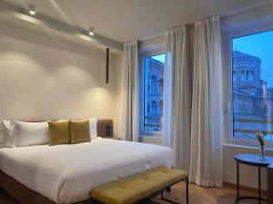 a bedroom with a large bed and a large window at Best Western Madison Hotel in Milan +97 photos