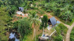 an aerial view of a house in the jungle at RMC Cabana in Udamulla