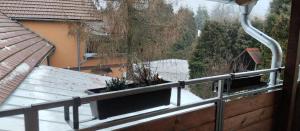 a balcony with a view of a river and trees at Pension u Veverků in Protivanov