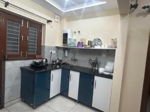 a kitchen with a sink and a counter top at Uttarayan The Homestay in Almora +12 photos