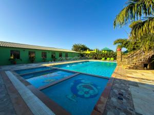 a swimming pool in front of a building at GREEN VALLEY SARISKA in Tehla