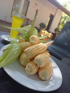 a plate of corn on the cob on a table at Zendora Resort Yala in Tissamaharama