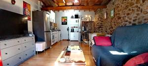 a living room with a couch and a coffee table at Casa el Envero in Saro