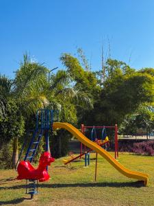 a playground with a slide in a park at GREEN VALLEY SARISKA in Tehla