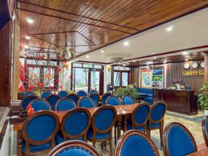 a room with a bunch of chairs and a table at Liberty Sapa Hotel in Sapa