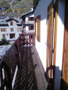 a view from the balcony of a building with windows at Cervinia in Breuil-Cervinia
