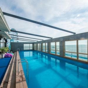 a large swimming pool on top of a building at Hotel Wolmido in Incheon