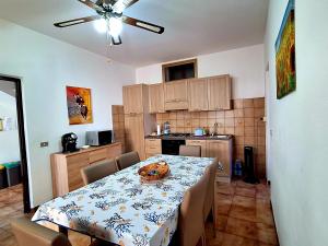 a kitchen with a table with a bowl on it at Mare&Monti Guest House with Private Parking in Telti
