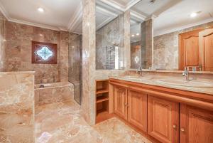 a large bathroom with two sinks and a shower at Can Maro in Santa Margalida +25 photos