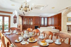 a dining room with a table with food on it at Can Maro in Santa Margalida