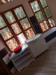 an overhead view of a kitchen with a large window at Venusia Villa in Darou Rhamane