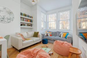 a living room with a couch and a chair at Beachway House in Weymouth