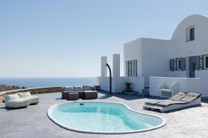 a patio with a pool and chairs and the ocean at Occhio-Nero Cycladic Private Villa with Pool & Sunset View Jacuzzi in Akrotiri