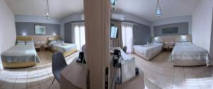 a large room with two beds and a living room at Thalia deco City & Beach Hotel in Hersonissos +109 photos