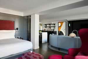 a bedroom with a bed and a living room at Sea Containers London in London +113 photos