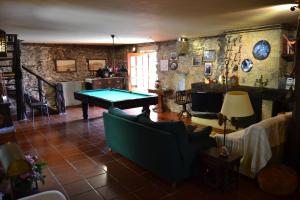 a living room with a ping pong table in it at Casa de Fujacos in Valença