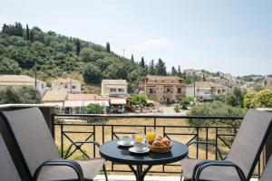a table with a bowl of food on a balcony at villa Fotini 2 (new) in Syvota