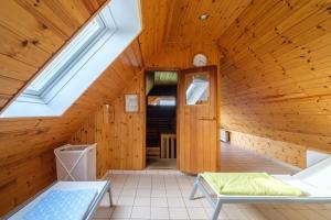 a room with a wooden ceiling with a window at Haus Nige Wark - Ferienwohnungen in Cuxhaven +212 photos