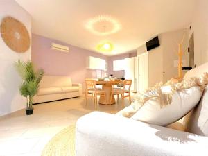 a living room with a couch and a table at Aura Suites Napoli in Naples