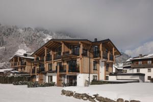 a ski lodge in the snow in the mountains at my Zillernest in Zell am Ziller