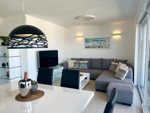 a living room with a couch and a table at Casa Bella in Malinska