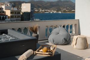 a balcony with a view of the water on a city at Luxury Suites by Lato in Agios Nikolaos
