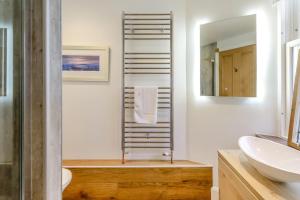 a bathroom with a sink and a toilet and a mirror at 4 Bed in Pittenweem oc-t35090 in Pittenweem +28 photos