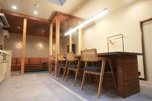 a dining room with a table and chairs at 侘然 - Wabizen - in Ikeda