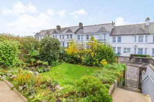 a garden in front of a large building at 4 Bed in St. Austell oc-t32965 in St Austell