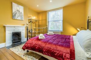 a bedroom with a bed and a fireplace at 5 Bed in Llangollen oc-l34205 in Llangollen