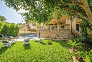 an image of a backyard with a swimming pool at Ideal Property Mallorca - Can Besso in Alcanada