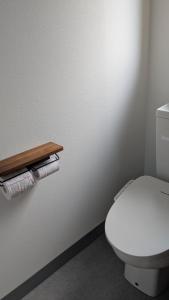 a bathroom with a white toilet and some towels at Aioi house in Tsubetsu +19 photos