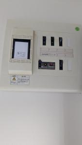 a room with a control panel on a wall at Aioi house in Tsubetsu