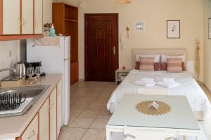 a kitchen with a large bed in a room at Stergios_Apartments 05 in Kozani