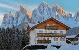 a house in front of a snowy mountain at Fillerhof in Villnoss