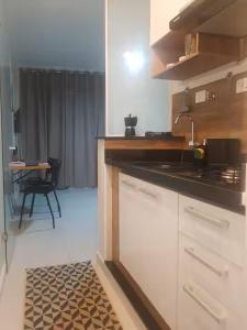 a kitchen with a sink and a counter top at Studio 215 Campinas SP in Campinas +19 photos