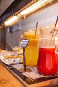 two jars of condiments on a counter in a kitchen at Pousada Barra De Maragogi in Maragogi
