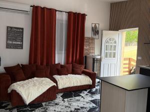 a living room with a couch and a table at Boston - Loft with Jacuzzi in Sanary-sur-Mer