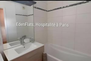 a bathroom with a sink and a bath tub at Citronnelle, 2 Chambres, 3 min Métro 8 in Maisons-Alfort