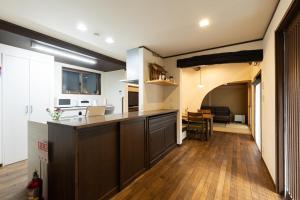a kitchen with a large island in a room at Arai アライ in Takayama